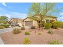 Street view of a single-story home featuring desert landscaping and an attached two-car garage at 696 W Glen Canyon Dr, San Tan Valley, AZ 85140