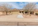 Charming single-story home boasts a tile roof, desert landscaping, and solar panels for energy efficiency at 760 W Douglas Ave, Gilbert, AZ 85233