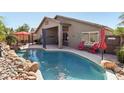 Relaxing backyard pool area with patio, lounge chairs, and privacy at 8014 W Ross Ave, Peoria, AZ 85382