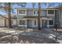 Inviting townhome with beautiful curb appeal, showcasing a well-kept exterior and charming architectural details at 860 N Mcqueen Rd # 1028, Chandler, AZ 85225