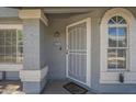 Close-up of front door, number 1028, with welcoming 'Welcome Home' mat at 860 N Mcqueen Rd # 1028, Chandler, AZ 85225