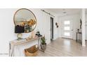 Bright entryway features a stylish console table, decorative mirror, and modern accents at 8738 E Rose Ln, Scottsdale, AZ 85250