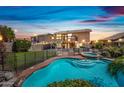 Inviting backyard featuring a large pool, spa, well-maintained lawn, and string lights for outdoor ambiance at 9364 S Margo Dr, Tempe, AZ 85284