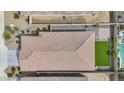 An aerial view of a single-Gathering home with a tiled roof, pool, and well-kept backyard at 12351 W Palmaire Ave, Glendale, AZ 85307