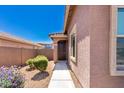 Charming home with a covered entry, tiled roof, and desert landscaping at 12351 W Palmaire Ave, Glendale, AZ 85307