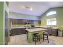 Spacious kitchen with a large island, stainless steel appliances, and plenty of cabinet space at 12905 W Crocus Dr, El Mirage, AZ 85335