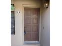 Traditional brown front door with a classic design, set in a neutral-toned exterior at 1449 E Highland Ave # 39, Phoenix, AZ 85014