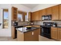 Kitchen featuring stainless steel appliances, granite countertops, tile backsplash, and bright lighting at 16113 E Andrew Dr, Fountain Hills, AZ 85268