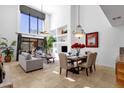 Living room and dining area boast large windows, modern lighting, and an open concept at 17025 E La Montana Dr # 123, Fountain Hills, AZ 85268
