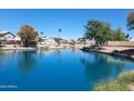 Peaceful waterfront view showcases the calm canal waters and surrounding residential neighborhood on a clear day at 1741 S Clearview Ave # 70, Mesa, AZ 85209