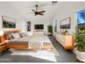 Spacious main bedroom with large windows, ceiling fan, and modern furnishings at 17494 N Maddaloni Ave, Maricopa, AZ 85138