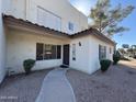 Inviting home exterior with a manicured walkway and desert-friendly landscaping at 1825 W Ray Rd # 1058, Chandler, AZ 85224