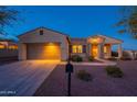 Inviting single-Gathering home with a neutral exterior, two-car garage, and attractive landscaping at 21913 N Pedregosa Ct, Sun City West, AZ 85375