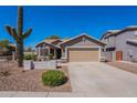 Charming single-Gathering home with a two-car garage, desert landscaping, and a stucco exterior at 23306 S 221St St, Queen Creek, AZ 85142
