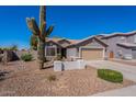 Charming single-Gathering home with a two-car garage, desert landscaping, and a stucco exterior at 23306 S 221St St, Queen Creek, AZ 85142