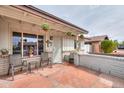 Charming covered front porch featuring comfortable seating and a welcoming entrance at 2504 E Riviera Dr, Tempe, AZ 85282