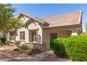Inviting single-story home with a tiled roof, stone accents, and desert-friendly landscaping at 2580 E Boston St, Gilbert, AZ 85295