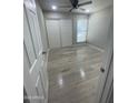 Bedroom with wood-look flooring, a ceiling fan, closet, and a window at 2662 N 43Rd Ave # B, Phoenix, AZ 85009