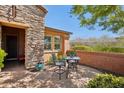 Outdoor patio area with brick flooring, perfect for relaxing and enjoying the Arizona weather at 28351 N 130Th Dr, Peoria, AZ 85383