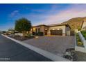 Beautiful home with a brick driveway, desert landscaping, and a two-car garage at 3529 N Boulder Canyon St, Mesa, AZ 85207