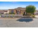 Charming single-story home featuring desert landscaping and a brick exterior, set against a desert mountain at 3529 N Boulder Canyon St, Mesa, AZ 85207