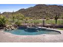Resort-style backyard pool and spa with a waterfall feature at 3529 N Boulder Canyon St, Mesa, AZ 85207