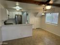 Open kitchen and dining area features modern appliances and lighting at 510 N Alma School Rd # 259, Mesa, AZ 85201