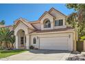 Beautiful two-story house featuring a terracotta roof, stucco exterior, and attached two-car garage at 6925 W Tonto Dr, Glendale, AZ 85308
