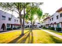 Beautiful townhome community featuring lush green spaces and charming architecture at 6961 E Osborn Rd # B, Scottsdale, AZ 85251