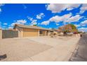 Spacious single-story home with a two car garage and desert landscaping at 8014 W Mescal St, Peoria, AZ 85345