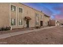 Townhome exterior shows desert landscaping and multiple windows at 8226 N 32Nd Dr, Phoenix, AZ 85051