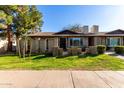 Attractive exterior showcasing the front yard and brick accents at 907 W Laguna Dr, Tempe, AZ 85282