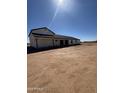 Ranch home with long porch and expansive dirt lot at 11142 E Copper Dust Trl, Florence, AZ 85132