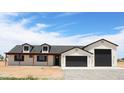 Charming single-story home with a 2-car garage and well-maintained front yard in a rural setting under a blue sky at 11142 E Copper Dust Trl, Florence, AZ 85132