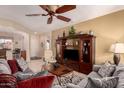 Spacious living room with couches, tile flooring and plenty of natural light at 15074 W Cactus Ridge Way, Surprise, AZ 85374