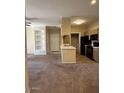 Open concept living space offering built-ins, plush carpet and an abundance of natural light at 16013 S Desert Foothills Pkwy # 1050, Phoenix, AZ 85048