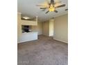 Inviting living room with overhead lighting and breakfast bar overlooking the kitchen at 16013 S Desert Foothills Pkwy # 1050, Phoenix, AZ 85048