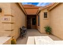 Inviting entryway showcasing a cozy seating area, house numbers, and a clear view into the home at 3023 E Silversmith Trl, San Tan Valley, AZ 85143