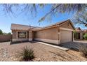 Charming single-story home featuring a tile roof, two-car garage and well-maintained desert landscaping at 3117 W Casino Ave, Phoenix, AZ 85083
