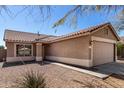 Charming single-story home featuring a tile roof, two-car garage and well-maintained desert landscaping at 3117 W Casino Ave, Phoenix, AZ 85083