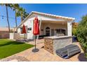 Covered patio area complete with a built-in barbeque, perfect for outdoor entertaining and relaxation at 4779 W Tulsa St, Chandler, AZ 85226