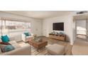 Bright living room featuring modern furniture, neutral tones, and natural light at 5323 E Dodge St, Mesa, AZ 85205