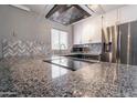 Modern kitchen with granite countertops and stainless steel appliances at 6240 N 16Th St # 40, Phoenix, AZ 85016