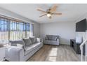 Cozy living room featuring a large bright window, recessed lighting, and comfortable seating at 6351 N 49Th Ave, Glendale, AZ 85301