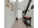 Hallway with tiled floors, stylish décor, and staircase at 706 E Washington St # 204, Phoenix, AZ 85034