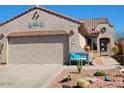 Charming single-story home with desert landscaping, a two-car garage, and a cozy entryway at 8205 S Pioneer Ct, Gold Canyon, AZ 85118