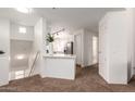 Inviting landing area with a breakfast bar that offers sightlines to the kitchen with stainless appliances at 11260 N 92Nd St # 2023, Scottsdale, AZ 85260