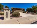 View of house with front yard desert landscaping and private two car garage at 16902 W Marcos De Niza Dr, Surprise, AZ 85387