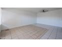 A spacious living room with tile flooring and a ceiling fan at 2646 N 43Rd Ave # B, Phoenix, AZ 85009