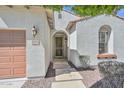 Inviting entrance with a secure screen door, stepping stones, and easy access to the two-car garage, perfect for homeowners at 29674 N 127Th Ln, Peoria, AZ 85383